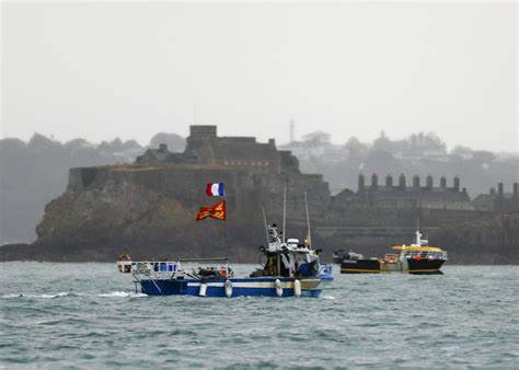 France toughens up in fishing dispute with Britain
